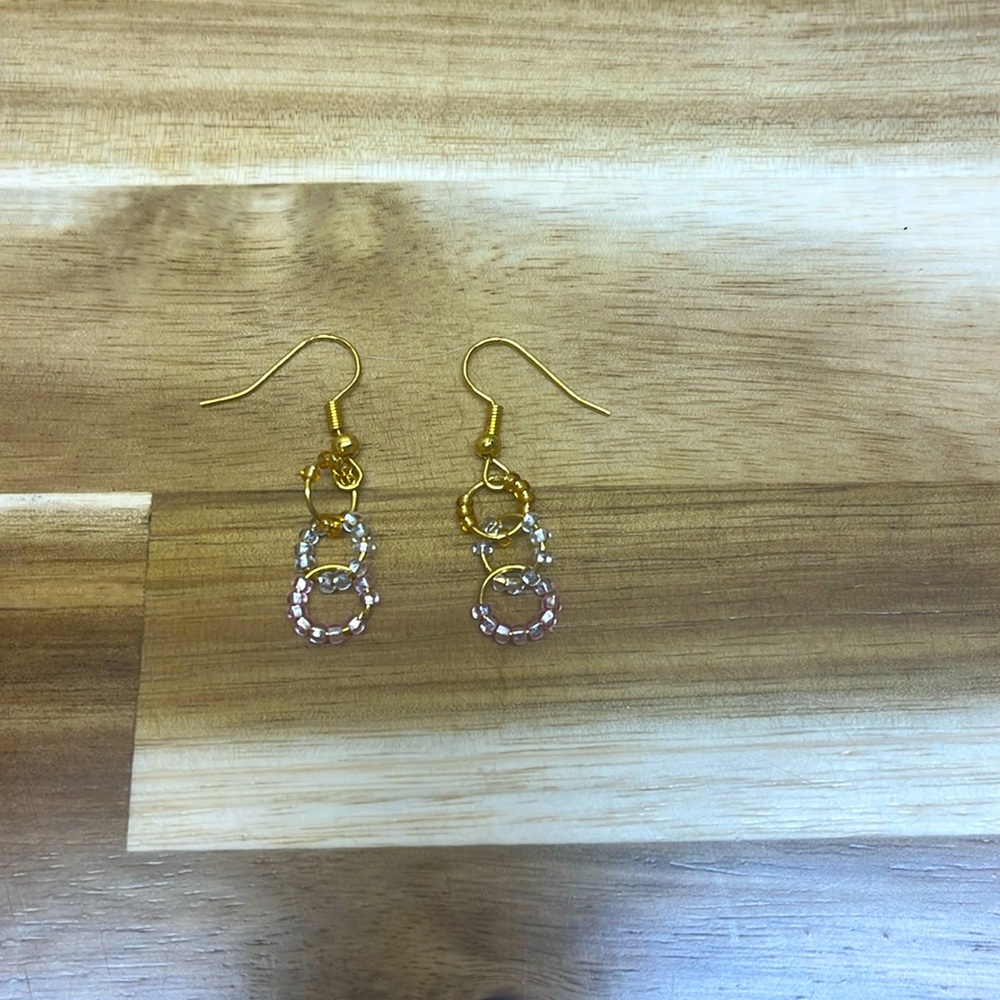 gold earrings with pink gold and translucent beaded loops